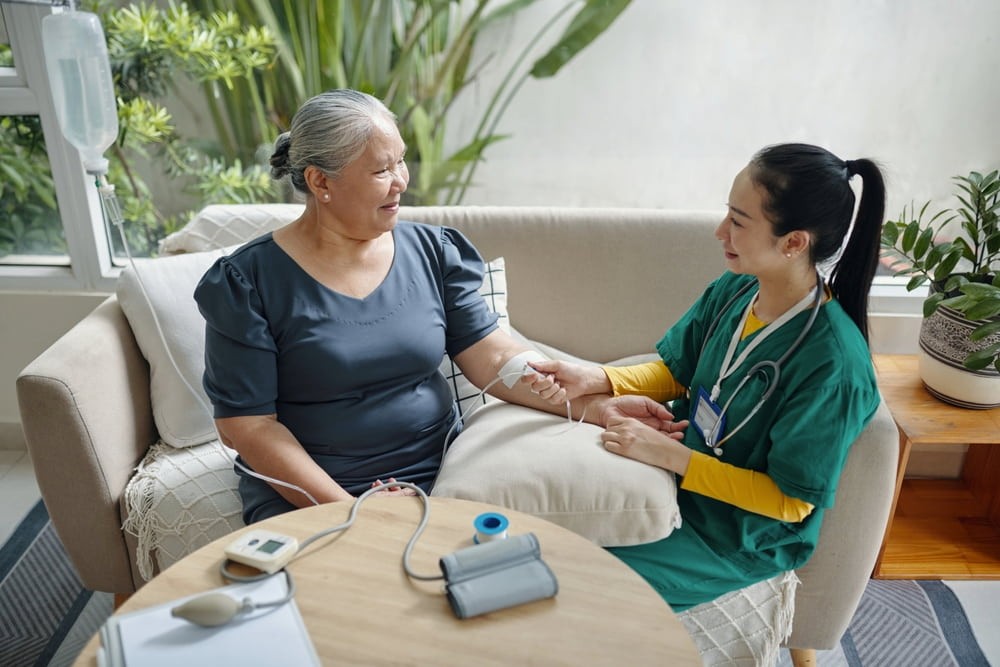 A senior-age woman benefits from IV drip therapy